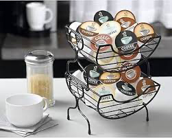 Countertop coffee station organizer holding mugs, pods, and accessories