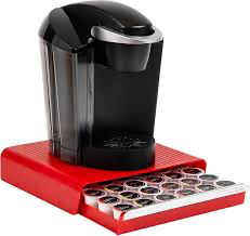 Coffee pod drawer organizer placed under a single serve coffee machine