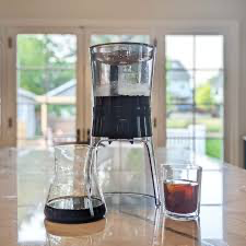 Cold brew coffee maker with glass carafe and fresh coffee concentrate