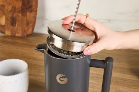 French press coffee maker brewing rich coffee at home