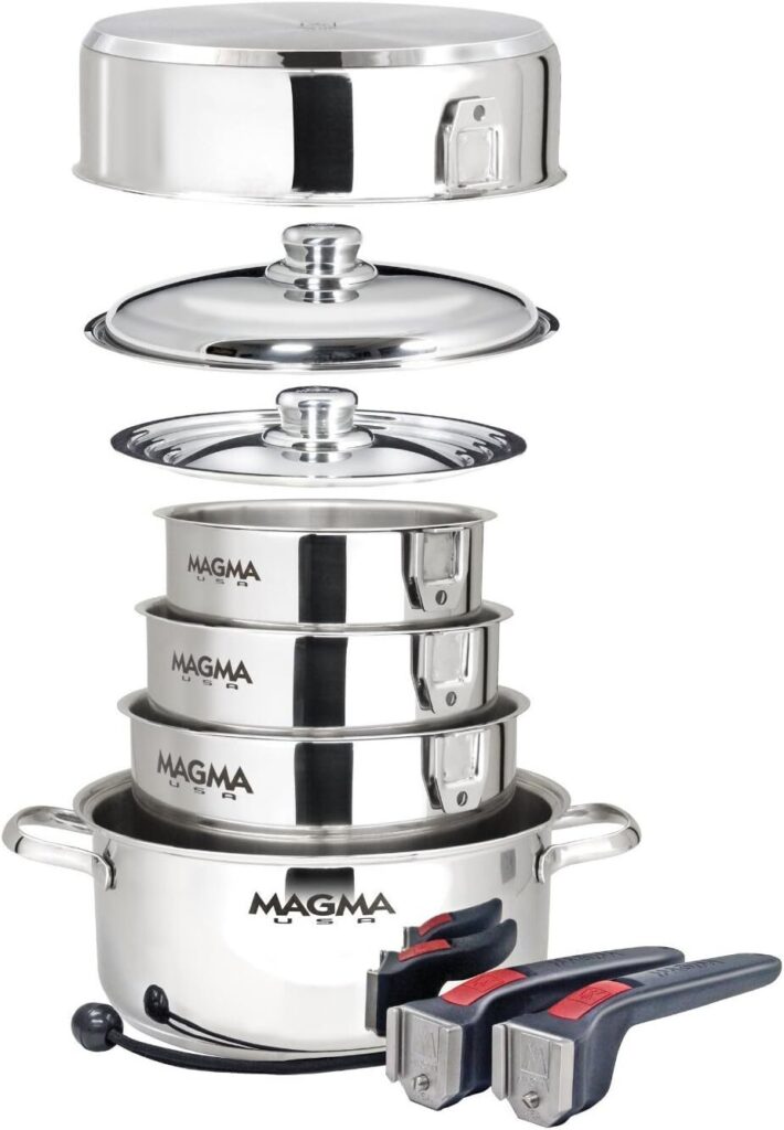 Stackable cookware set with detachable handles neatly arranged in a drawer.