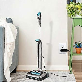 Bissell cordless vacuum cleaning kitchen hard floor near dining area