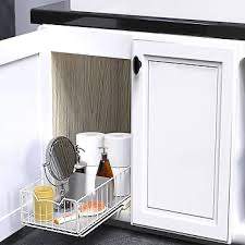 Pull-out corner cabinet organizer fully extended with kitchen supplies