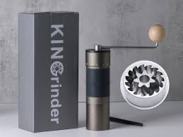 Manual single-dose coffee grinder with fresh beans and brewing accessories
